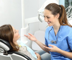 patient talking to dentist about oral conscious sedation in Plano
