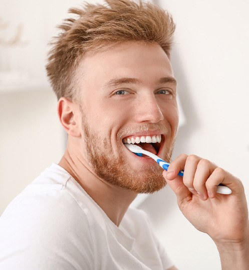 A man brushing his teeth