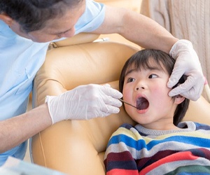 Little boy getting checkup from Plano dentist