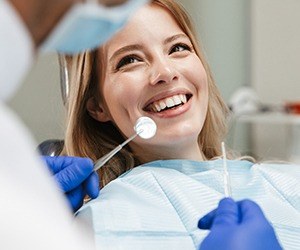 A smiling dental patient at a dentist’s office