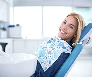 Happy woman in dental chair