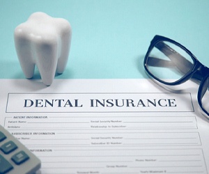 Dental insurance form, glasses, molar, and calculator