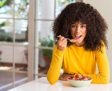 young woman eating cereal