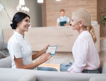 team member going over financial options with patient in Plano