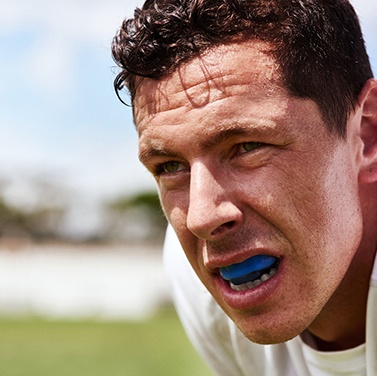 Team of soccer players smiling happily