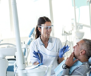 Dentist talking to patient about nitrous oxide sedation