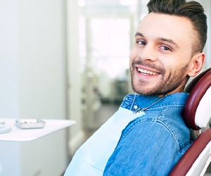 Man smiling in dentist's treatment chair