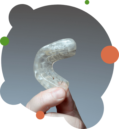 Close-up of hand holding nightguard for bruxism