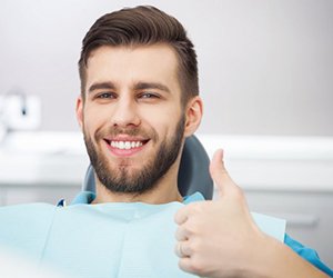 Candidate for nitrous oxide dental sedation in Plano giving thumbs up