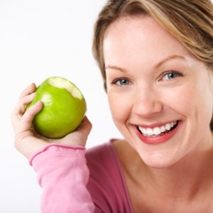 Woman eating an apple