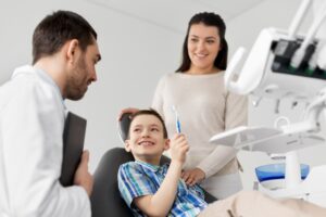 Mother with son at dentist's office. 