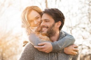 Happy, loving couple with beautiful smiles