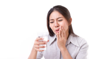 woman suffering from tooth sensitivity
