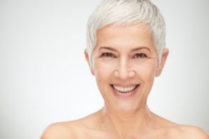older woman smiling with white hair